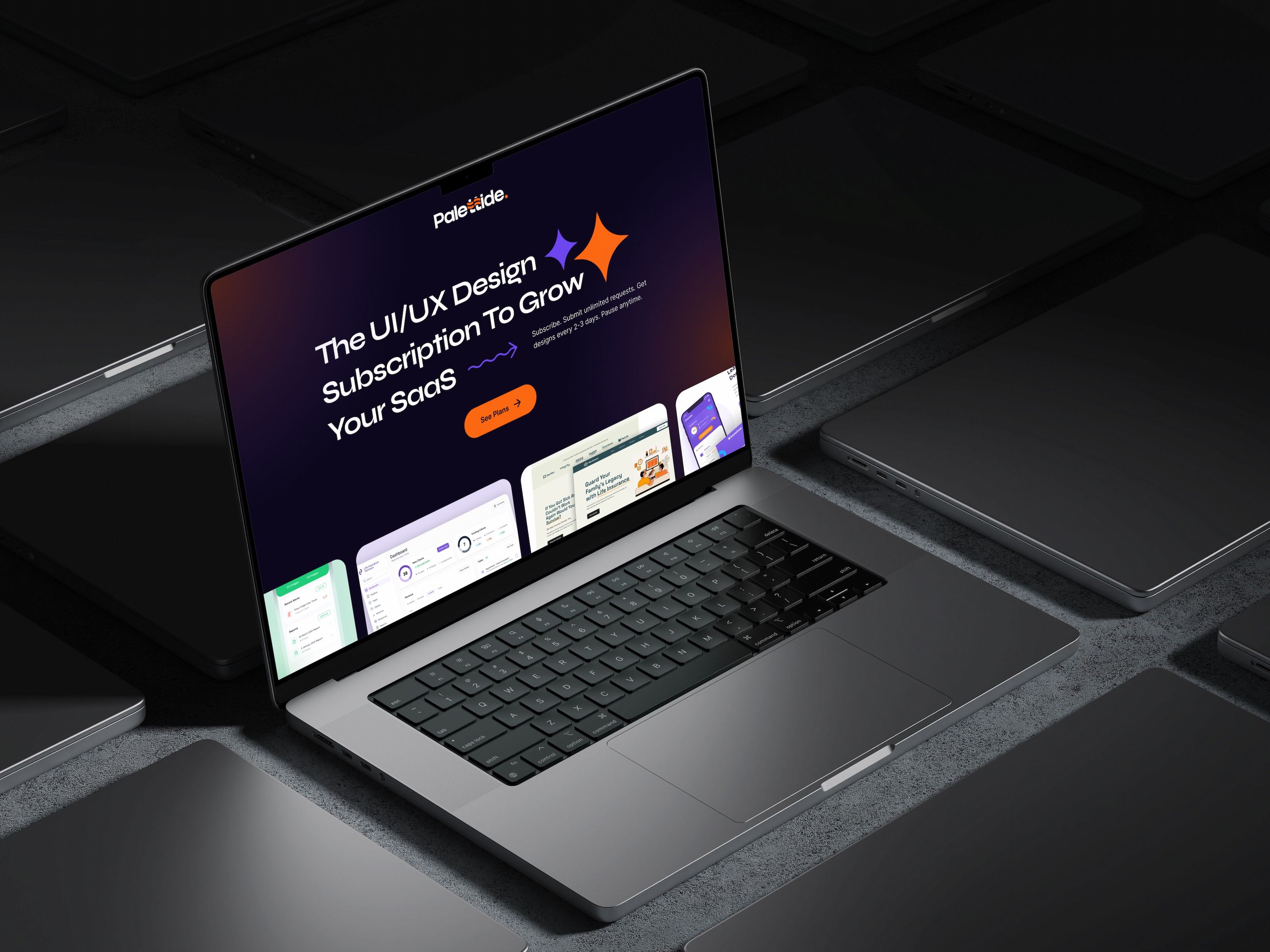 The Palettide homepage on a MacBook Pro resting on a dark desk of closed laptops