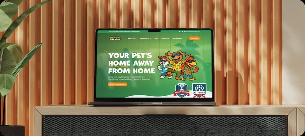 The Paws Paradise homepage on a MacBook Air on a wooden console